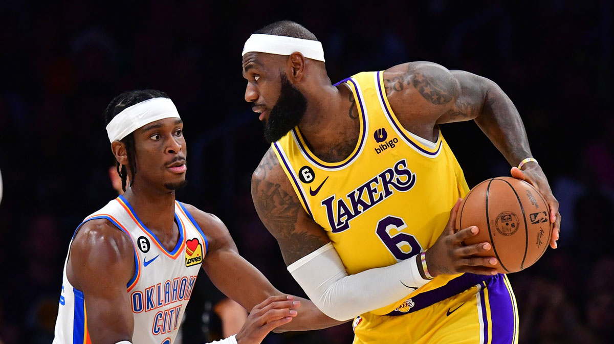 Oklahoma City Thunder guard Shai Gilgeous-Alexander (2) defends against Los Angeles Lakers forward LeBron James (6) in the second quarter at Crypto.com Arena.