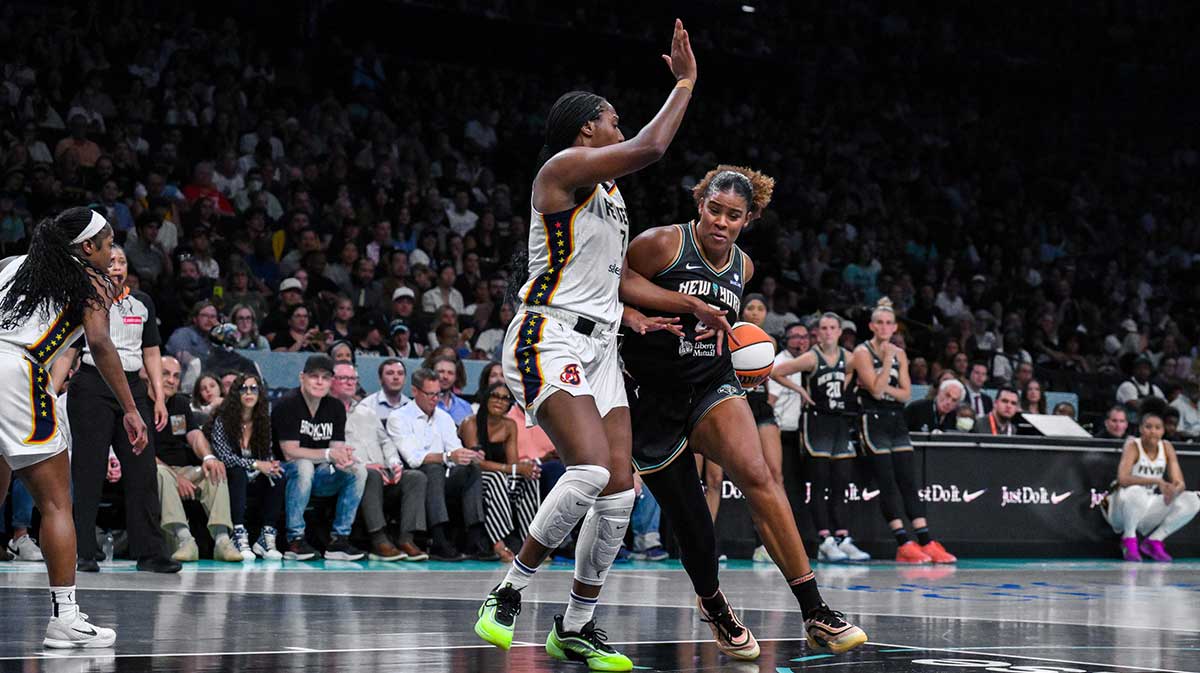 New York Liberty center Nyara Sabally (8) drives to the basket while defended by Indiana Fever forward Aliyah Boston (7) during the first half at Barclays Center.