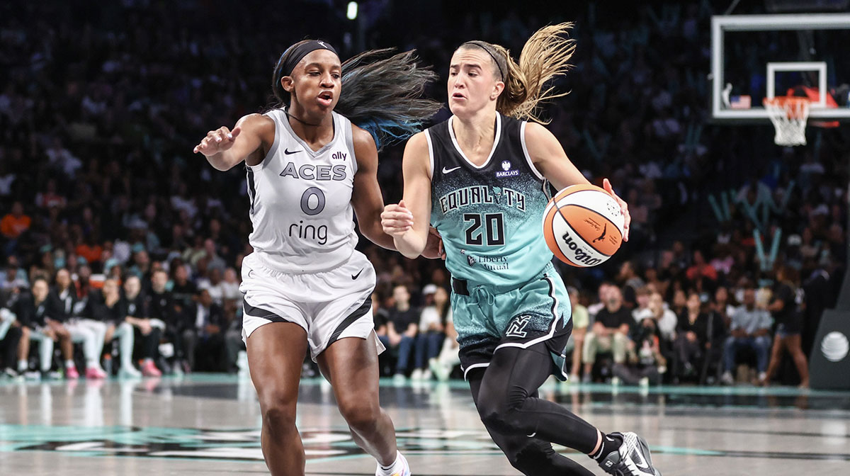New York Liberty guard Sabrina Ionescu (20) drives past Las Vegas Aces guard Jackie Young (0) in the third quarter at Barclays Center.