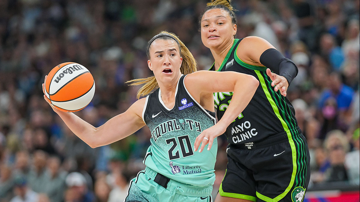New York Liberty guard Sabrina Ionescu (20) dribbles against the Minnesota Lynx guard Kayla McBride (21) in the third quarter at Target Center.