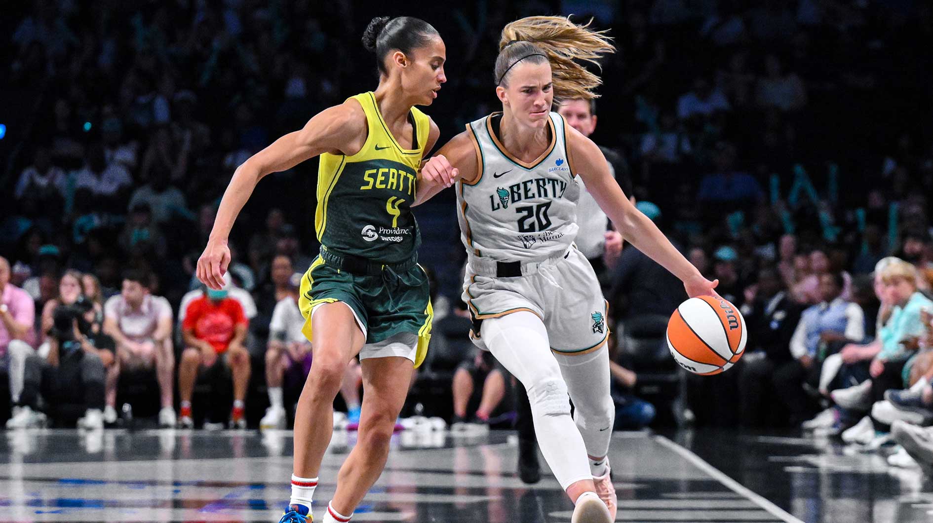 New York Liberty guard Sabrina Ionescu (20) brings the ball up court defended by Seattle Storm guard Skylar Diggins (4) during the second half at Barclays Center.