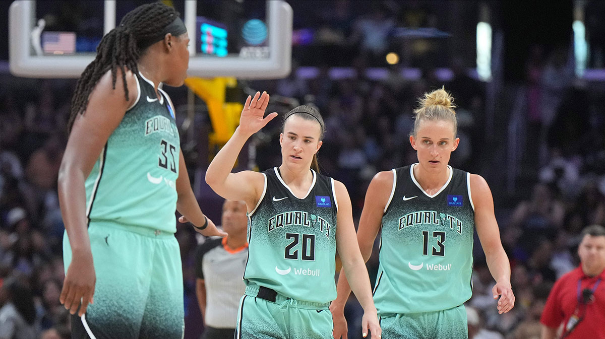 New York Liberty forward Jonquel Jones (35), guard Sabrina Ionescu (20) and forward Leonie Fiebich (13) react against the LA Sparks in the first half at Crypto.com Arena.