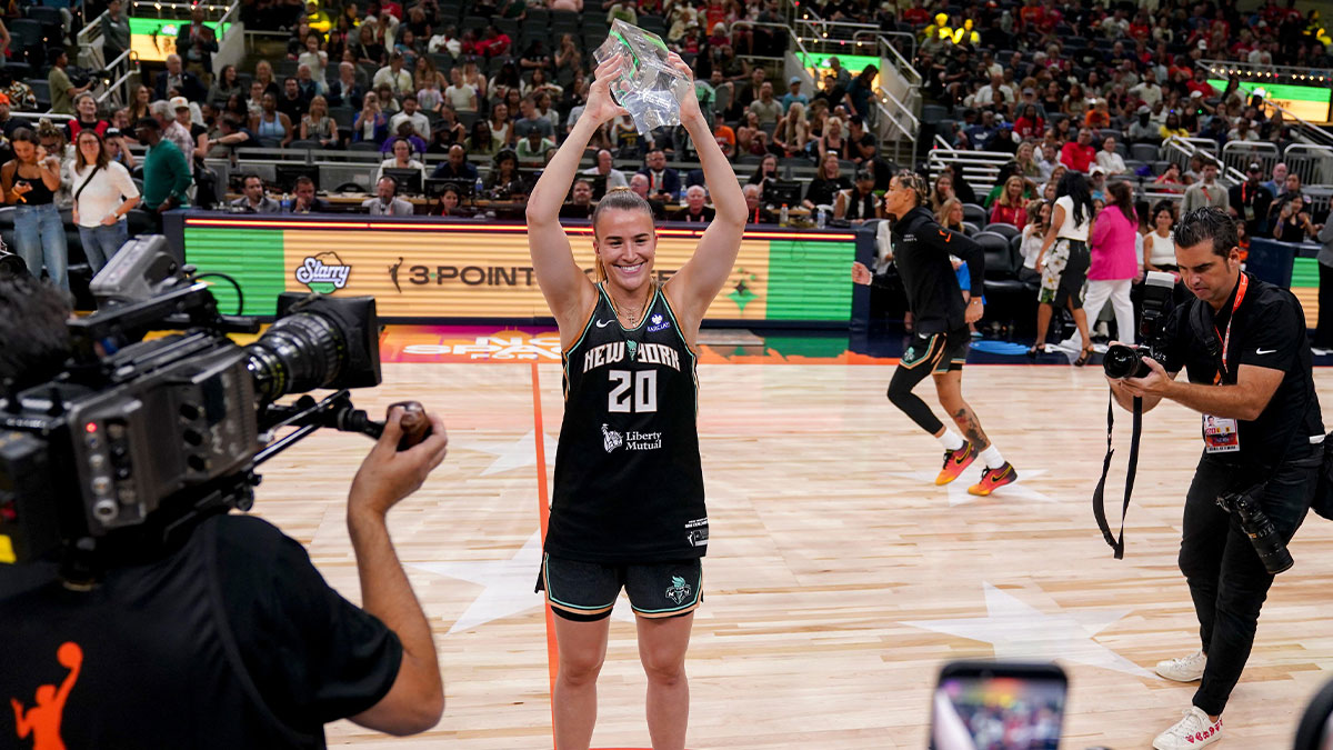 New York Liberty's Sabrina Ionescu (20) holds up her trophy Friday, July 18, 2025, during the WNBA All-Star 3-point contest at Gainbridge Fieldhouse in Indianapolis.