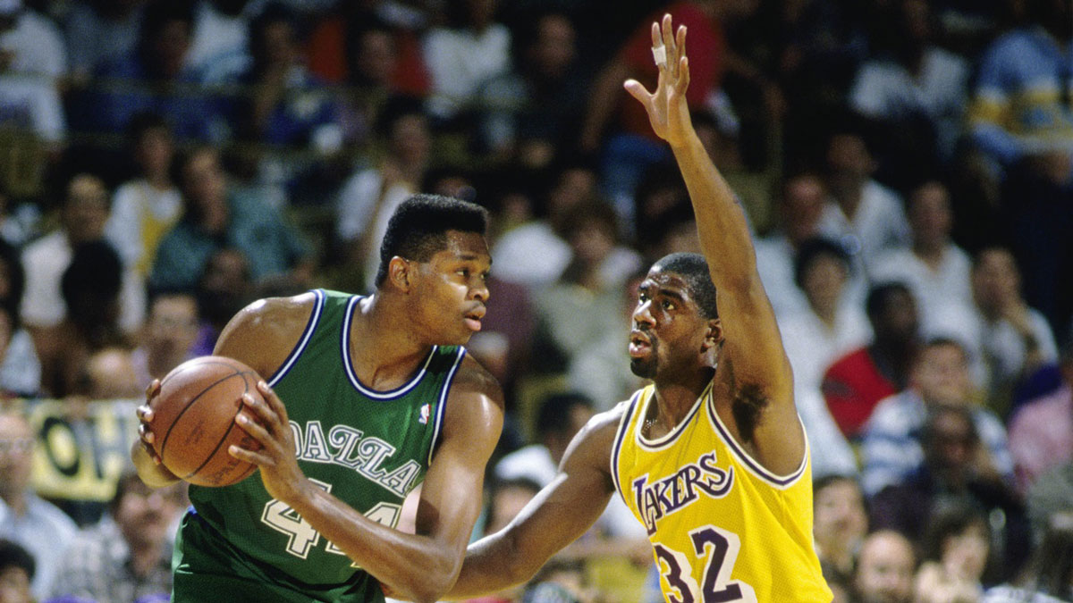 Dallas Mavericks center Sam Perkins (44) is defended by Los Angeles Lakers guard Magic Jonson during the 1988 Western Conference Finals at The Forum.