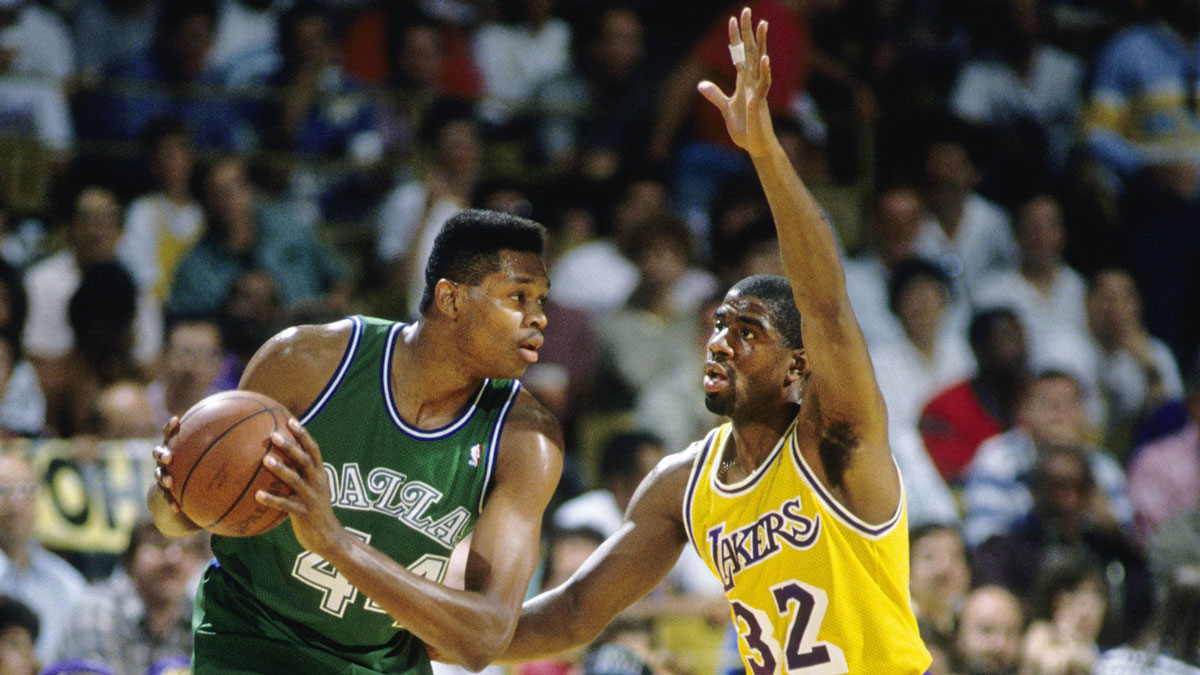 Dallas Mavericks center Sam Perkins (44) is defended by Los Angeles Lakers guard Magic Jonson during the 1988 Western Conference Finals at The Forum.