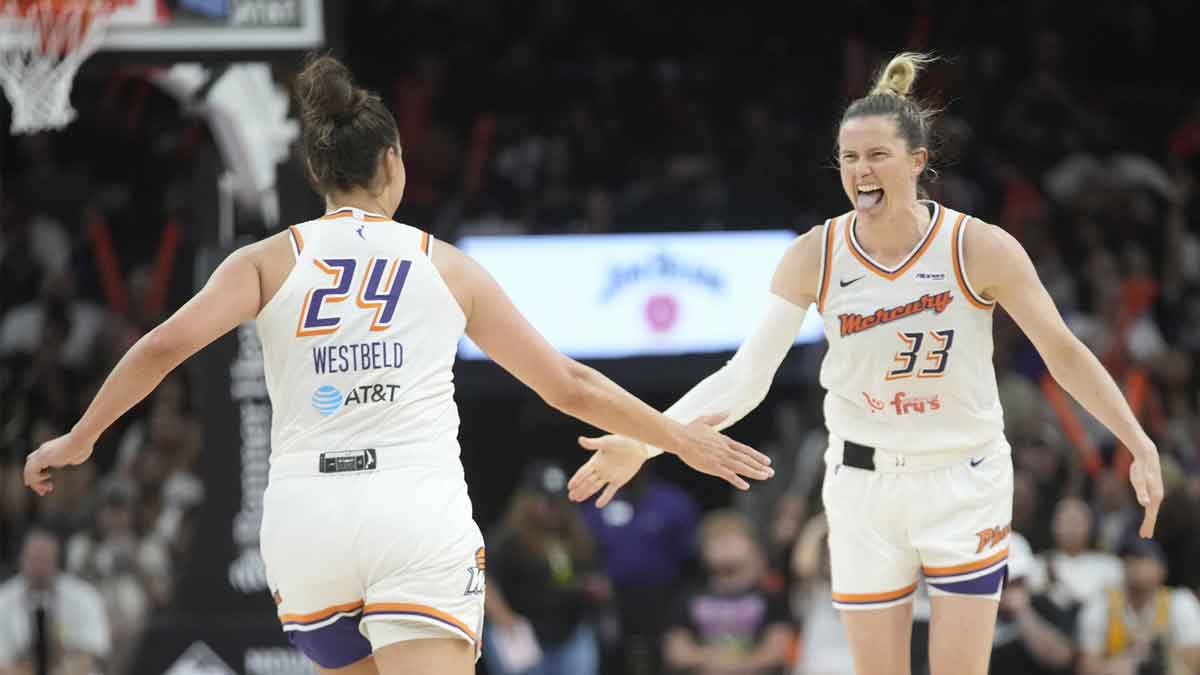 Phoenix Mercury guard Sami Whitcomb (33) celebrates a three-point basket with forward Kathryn Westbeld (24) against the Dallas Wings during the third quarter at PHX Arena on July 7, 2025.