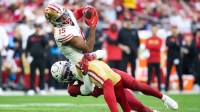 San Francisco 49ers wide receiver Jauan Jennings (15) is tackled by Arizona Cardinals cornerback Garrett Williams (21) at State Farm Stadium.