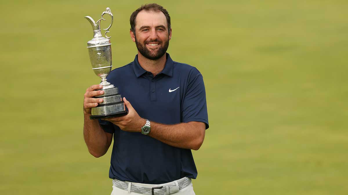 Scottie Scheffler celebrates with the Claret Jug after winning the 153rd Open Championship golf tournament at Royal Portrush.
