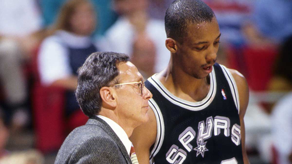 San Antonio Spurs head coach Larry Brown talks to guard Sean Elliott (32) against the Orlando Magic during the 1990-91 season at the Orlando Arena.