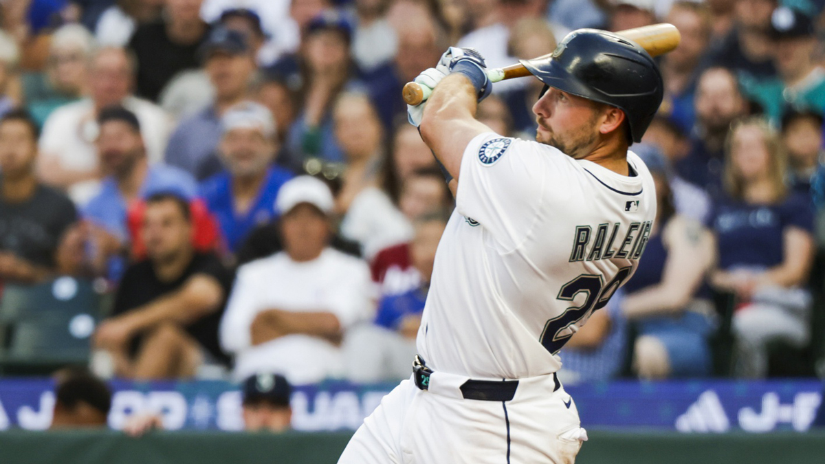 Seattle Mariners catcher Cal Raleigh (29) hits a solo-home run against the Milwaukee Brewers during the sixth inning at T-Mobile Park.