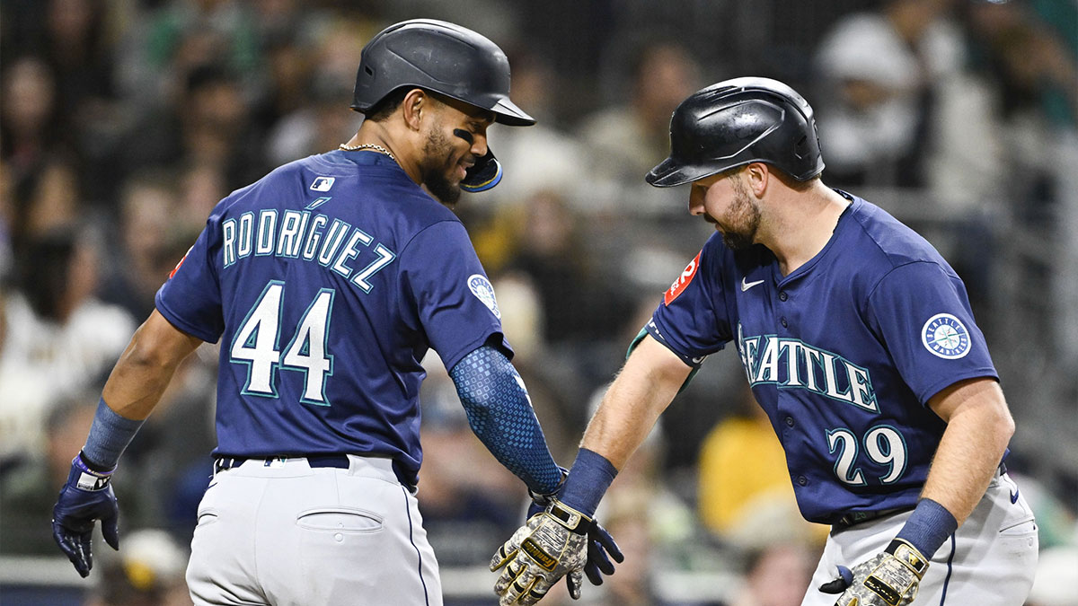 Seattle Mariners catcher Cal Raleigh (29) is congratulated by Julio Rodriguez (44) after hitting a two-run home run during sixth inning against the San Diego Padres at Petco Park