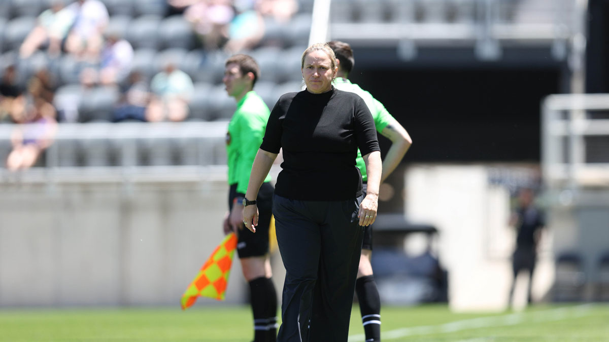 Seattle Reign FC head coach Laura Harvey watches the game during the first half against Racing Louisville FC at Lynn Family Stadium.