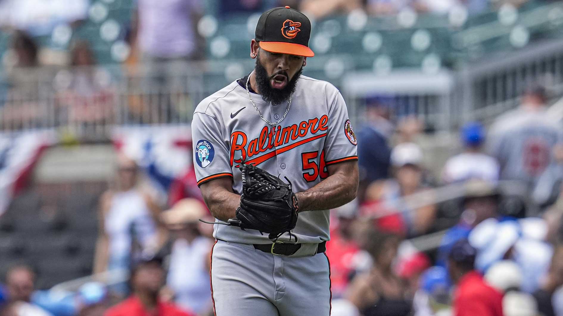 Baltimore Orioles relief pitcher Seranthony Dominguez (56) reacts after recording the final out against the Atlanta Braves during the ninth inning at Truist Park.