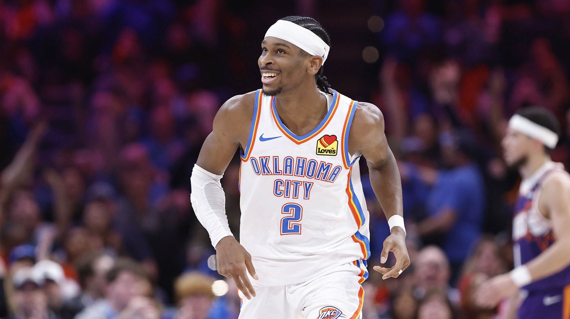 Oklahoma City Thunder guard Shai Gilgeous-Alexander (2) smiles after scoring against the Phoenix Suns during the second half of a game at Paycom Center.