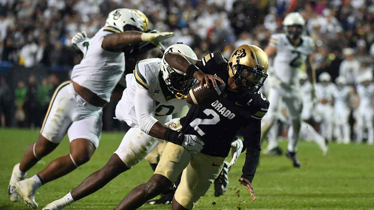 Colorado Buffaloes quarterback Shedeur Sanders (2) is sacked by Baylor Bears linebacker Steve Linton (10) during the second half at Folsom Field.