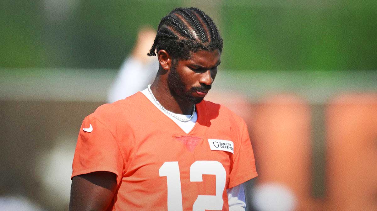 Cleveland Browns quarterback Shedeur Sanders (12) looks at a play sheet during training camp at CrossCountry Mortgage Campus.