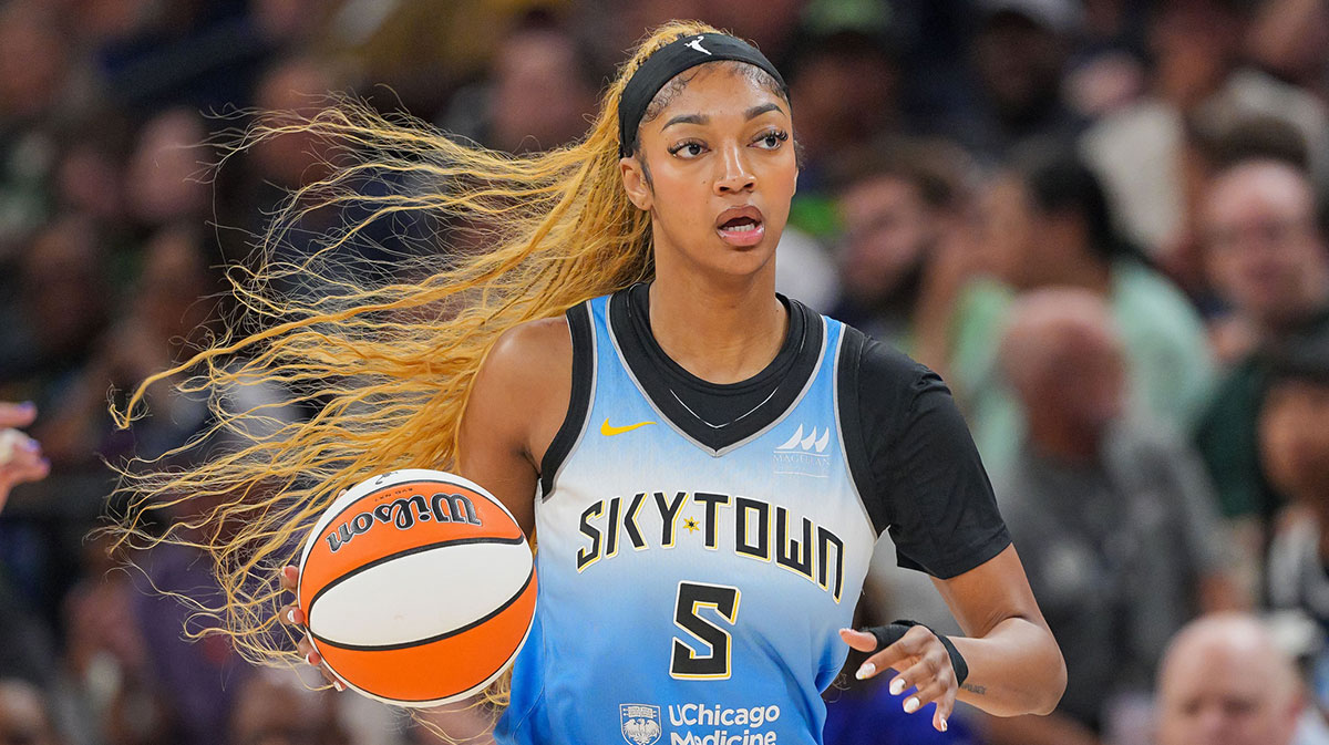 Sky forward Angel Reese (5) dribbles against the Minnesota Lynx in the first quarter at Target Center with Candace Parker in the background