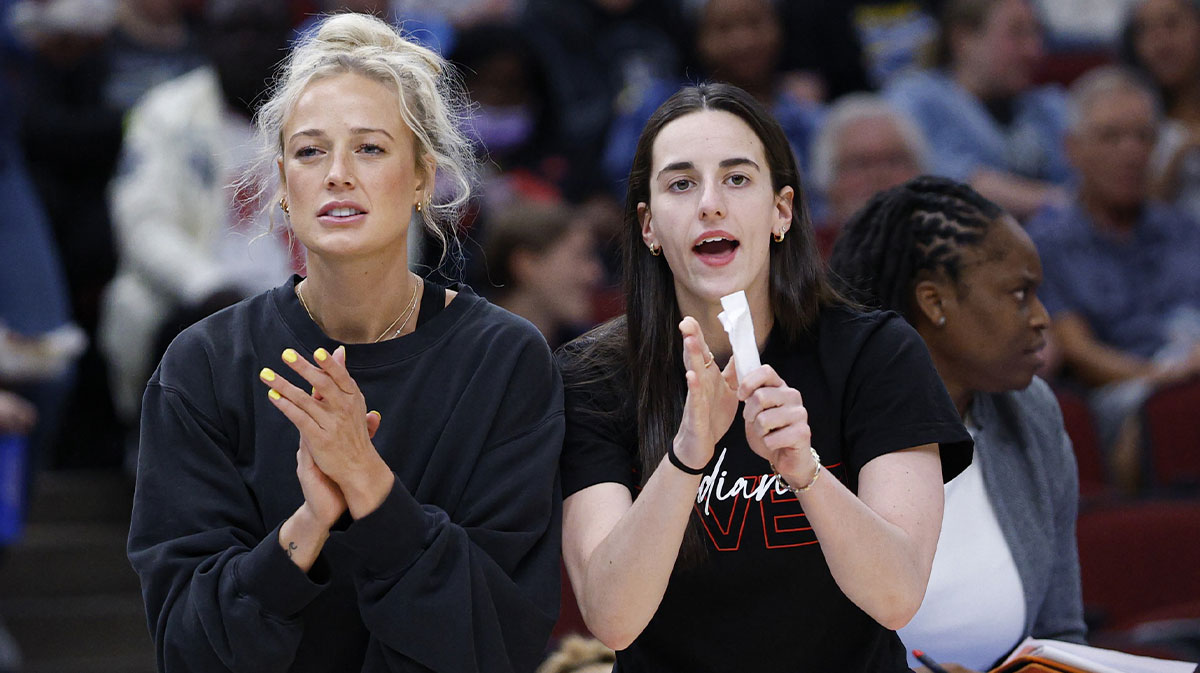 Injured Indiana Fever guard Sophie Cunningham (8) and guard Caitlin Clark (22) react from the bench during the first half of a WNBA game against the Chicago Sky at United Center.
