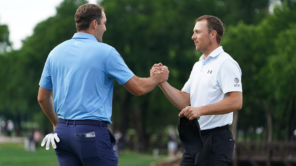 Scottie Scheffler and Jordan Spieth shake hands on the ninth green following their second round of the THE CJ CUP Byron Nelson golf tournament.