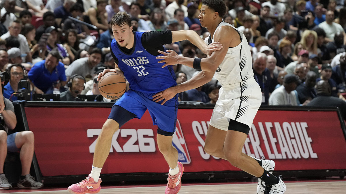 Dallas Mavericks forward Cooper Flagg (32) drives past San Antonio Spurs forward Carter Bryant (11) in the fourth quarter of their game at Thomas & Mack Center.