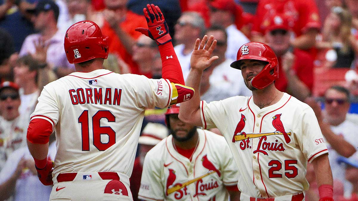 St. Louis Cardinals designated hitter Nolan Gorman (16) is congratulated by third baseman Thomas Saggese (25) after hitting a two run home run against the Atlanta Braves during the second inning at Busch Stadium.