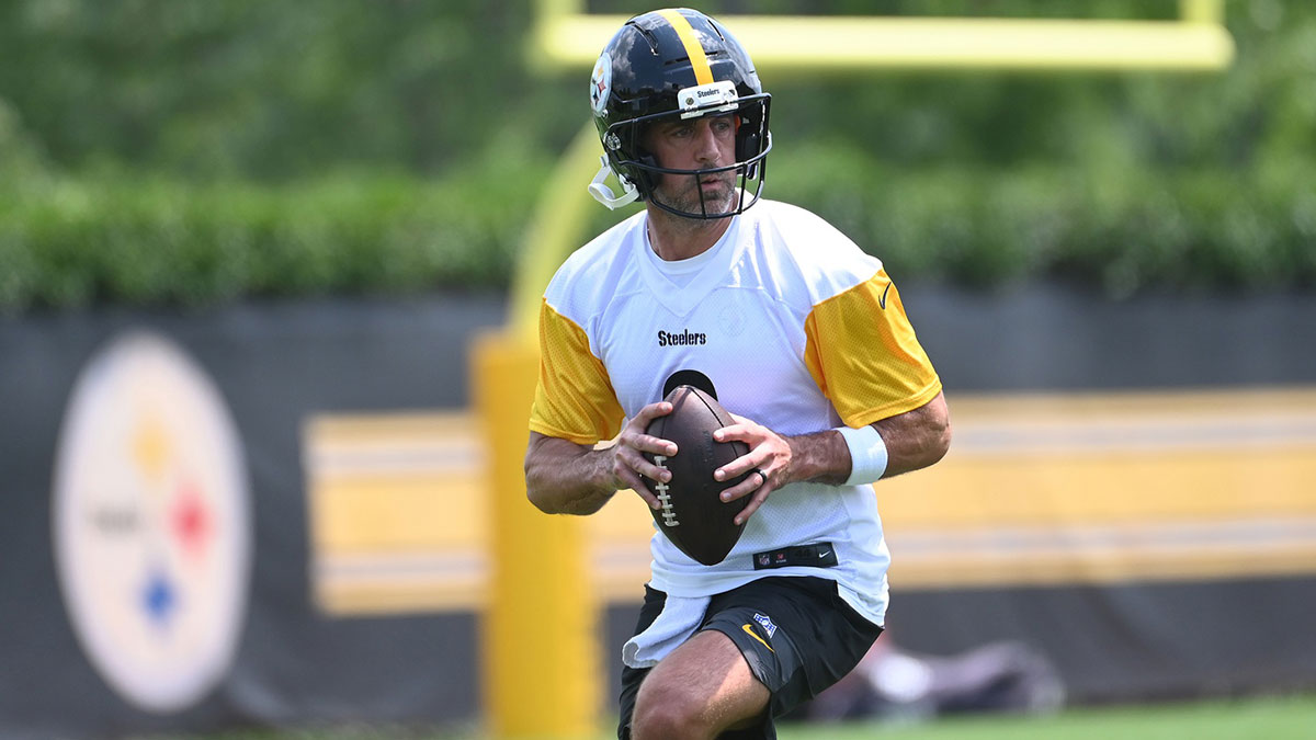 Steelers quarterback Aaron Rodgers (8) drops back to pass during minicamp at their South Side facility
