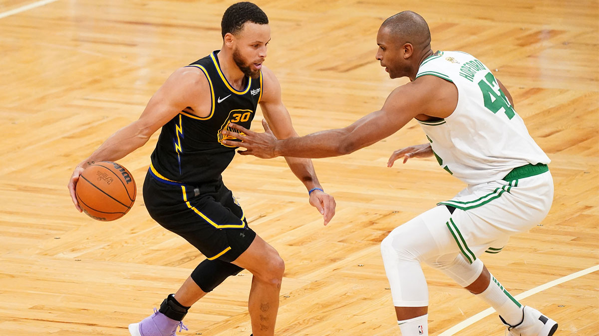 Boston Celtics center Al Horford (42) defends Golden State Warriors guard Stephen Curry (30) during the fourth quarter of game four in the 2022 NBA Finals at the TD Garden.