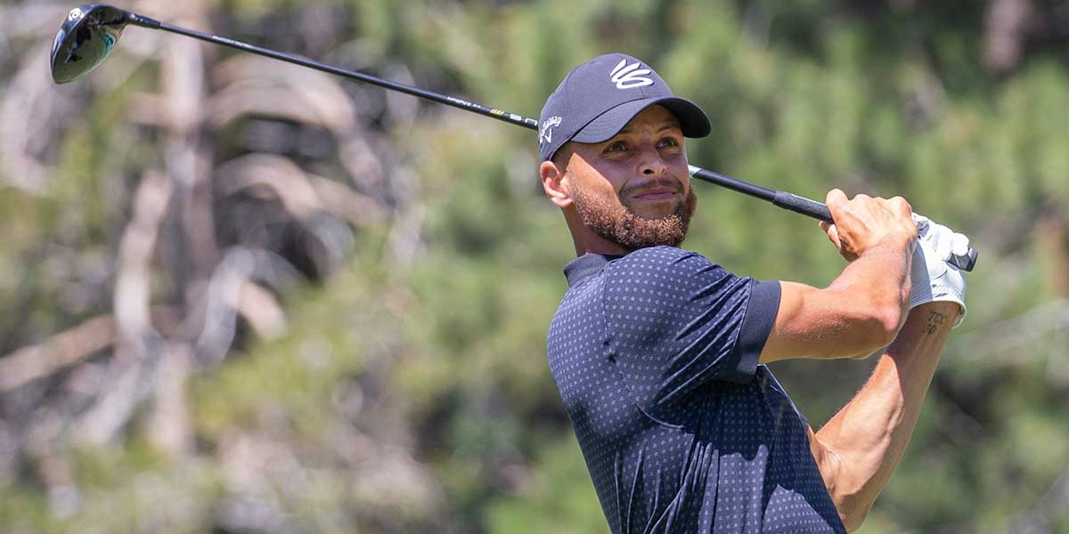 Golden State Warriors point guard Stephen Curry hits a tee shot on the 18th hole during the final round of the American Century Championship at Edgewood Tahoe Golf Course.