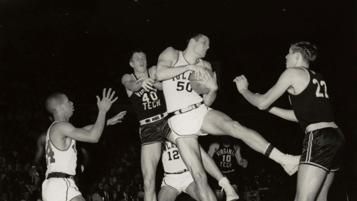 Toledo Rockets forward Steve Mix (50) in action against Virginia Tech Hokies center Ken Talley (40) during the 1967 season.