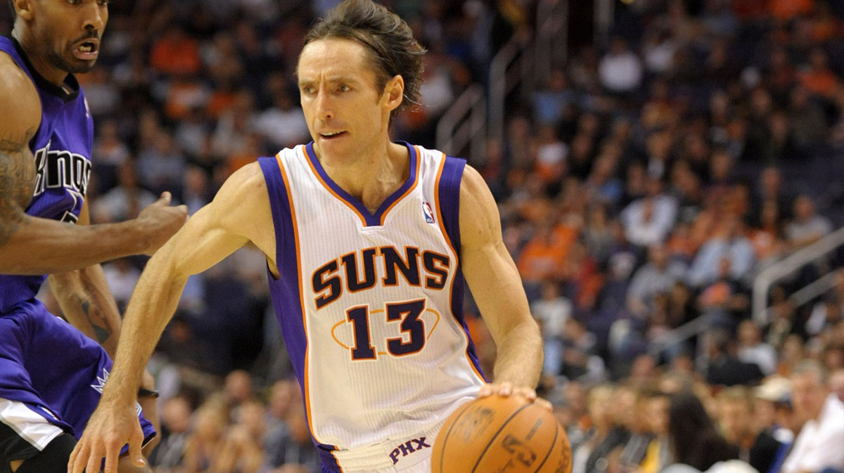 Phoenix Suns guard Steve Nash (13) dribbles the ball during the game against the Sacramento Kings at the U.S. Airways Center. The Suns defeated the Kings 103-89.