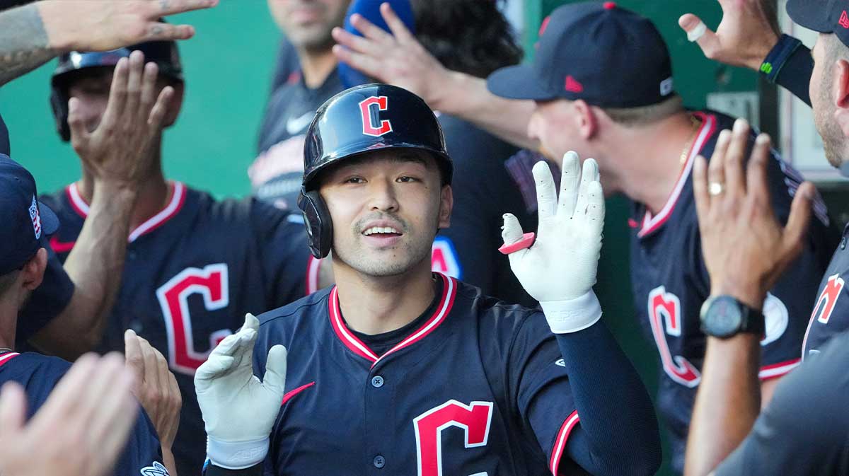 Cleveland Guardians left fielder Steven Kwan (38) celebrates in the dugout after hitting a two run home run against the Kansas City Royals in the fourth inning at Kauffman Stadium.