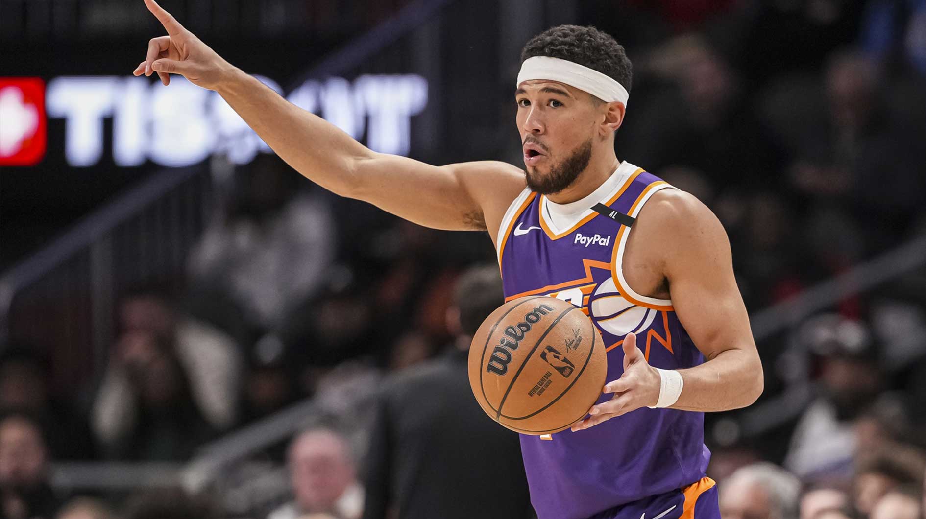 Phoenix Suns guard Devin Booker (1) directs his teammates against the Atlanta Hawks during the first half at State Farm Arena.