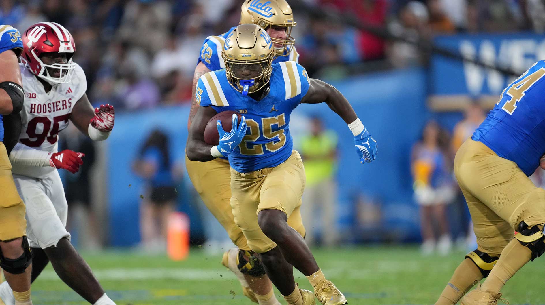 UCLA Bruins running back T.J. Harden (25) carries the ball in the second half against the Indiana Hoosiers at Rose Bowl.