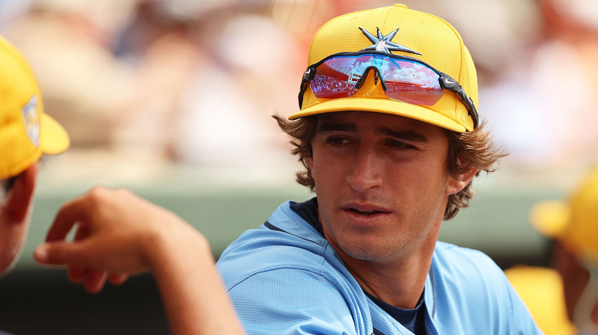Tampa Bay Rays infielder Carson Williams (80) talks with manager Kevin Cash (16) before the game against the Baltimore Orioles at Ed Smith Stadium.