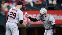 Detroit Tigers catcher Dillon Dingler (13) hands the ball to pitcher Tarik Skubal (29) during the fifth inning against the Texas Rangers at Globe Life Field.