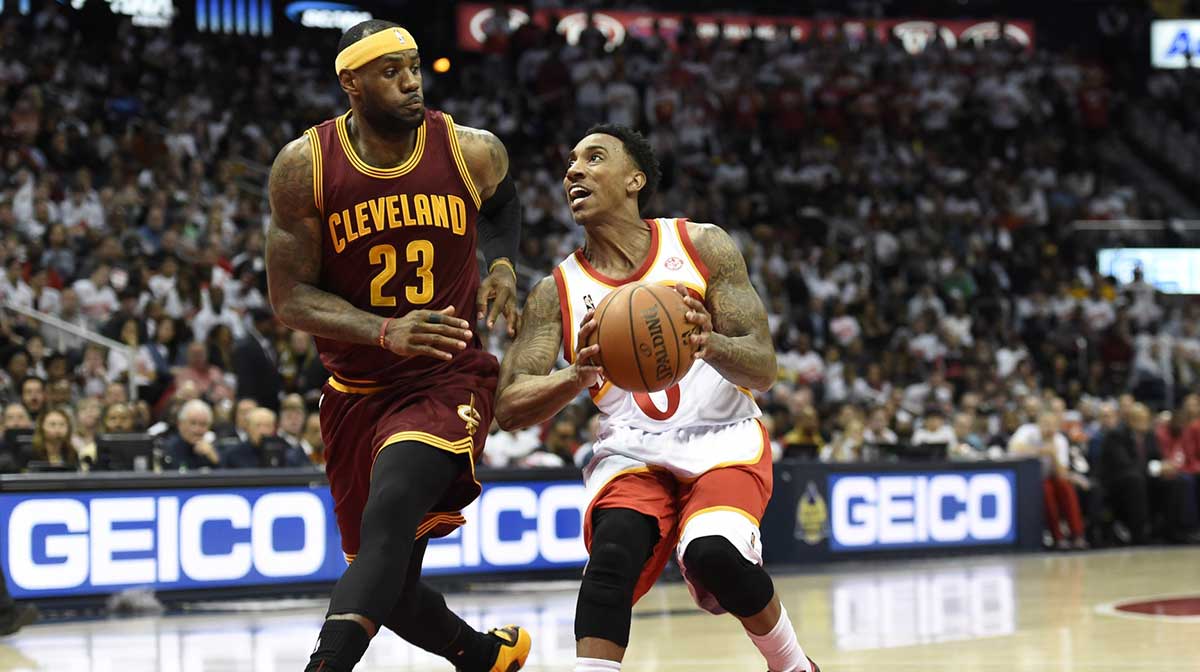 Atlanta Hawks guard Jeff Teague (0) prepares to shoot the ball as Cleveland Cavaliers forward LeBron James (23) defends during the second half at Philips Arena. The Hawks won 106-97.