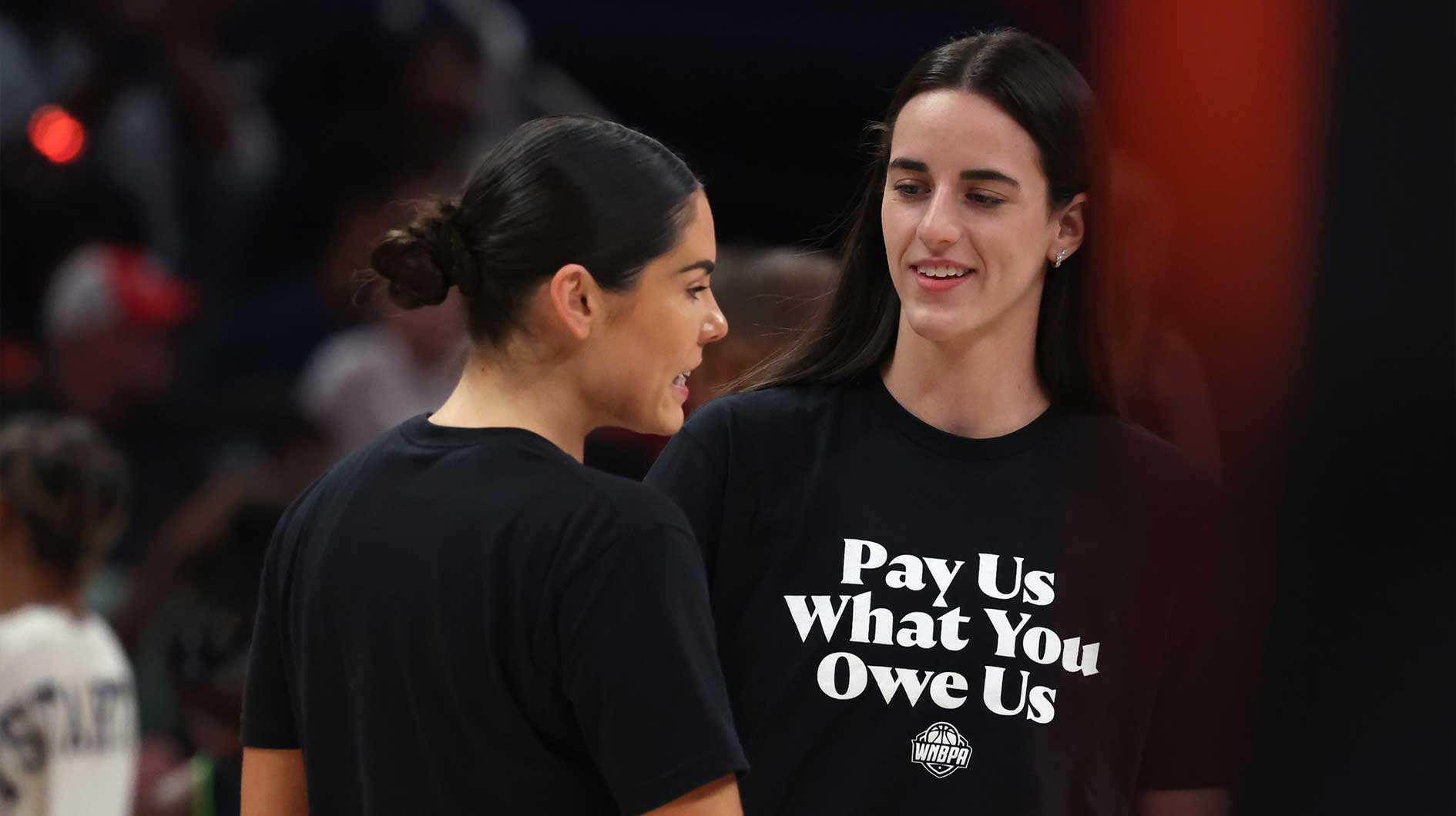 Team Clark guard Caitlin Clark (22) and Team Collier guard Kelsey Plum (10)