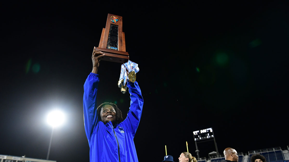 Miami Northwestern's Teddy Bridgewater raises the state trophy following the team's win over Raines in the Class 3A championship.