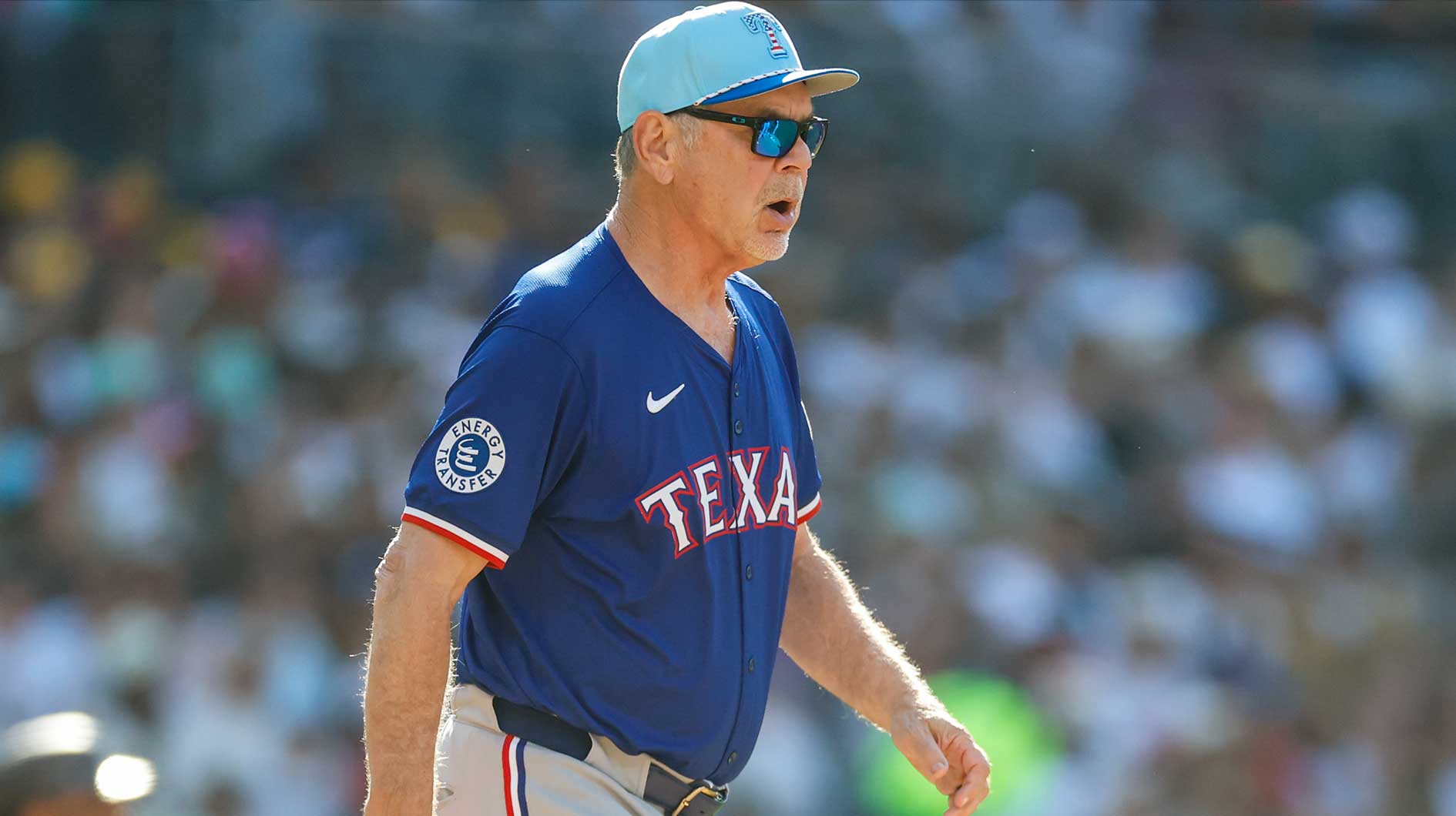 Texas Rangers manager Bruce Bochy (15) walks to the mound to make a pitching change during the sixth inning against the San Diego Padres at Petco Park.