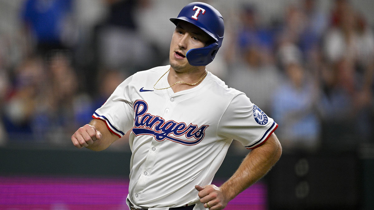 Texas Rangers left fielder Wyatt Langford (36) scores a run against the Kansas City Royals during the sixth inning at Globe Life Field.