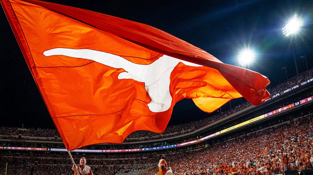 Texas Cheer waves a flag after a touchdown in the second half of the Longhorns' game against the ULM Warhawks at Darrell K Royal Texas Memorial Stadium