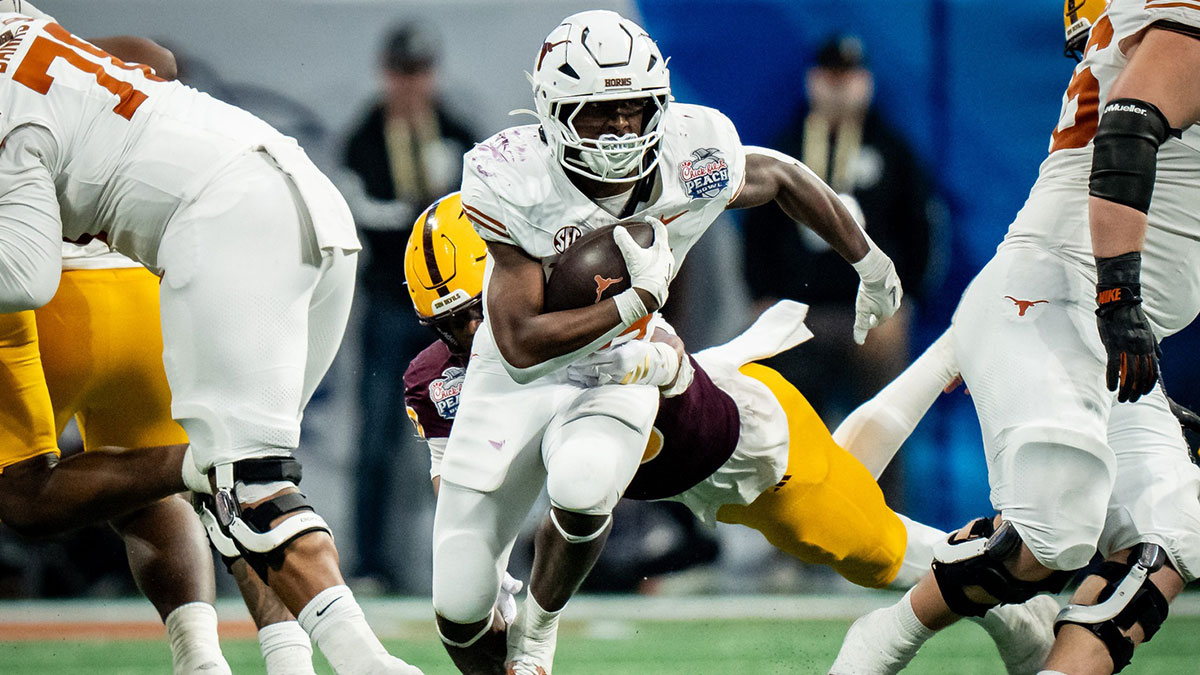 Texas Longhorns running back Quintrevion Wisner (26) carries the ball in the fourth quarter as the Texas Longhorns play the Arizona State Sun Devils in the Peach Bowl College Football Playoff quarterfinal at Mercedes-Benz Stadium in Atlanta, Georgia, Jan. 1, 2025.