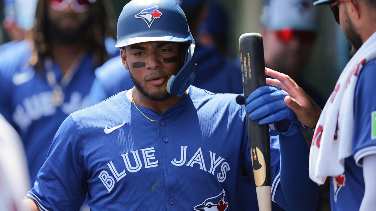 Toronto Blue Jays shortstop Leo Jimenez (49) celebrates after scoring against the St. Louis Cardinals during the second inning at Roger Dean Chevrolet Stadium.