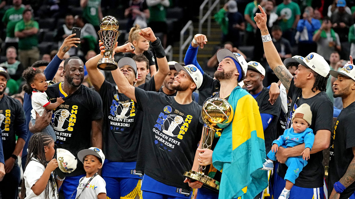 Golden State Warriors guard Stephen Curry (30) celebrates with the MVP trophy after the Golden State Warriors beat the Boston Celtics in game six of the 2022 NBA Finals to win the NBA Championship at TD Garden.