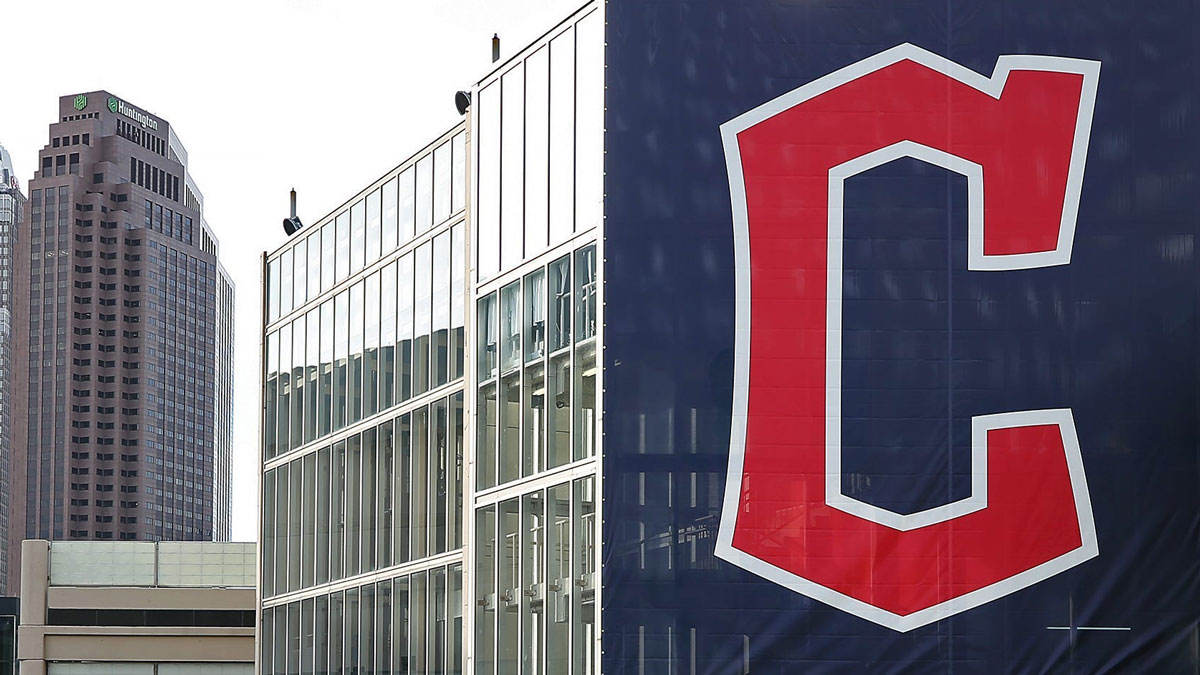 A banner with the Cleveland Guardians' new logo hangs from a parking deck before an MLB baseball game between the Cleveland Guardians and the San Francisco Giants at Progressive Field.