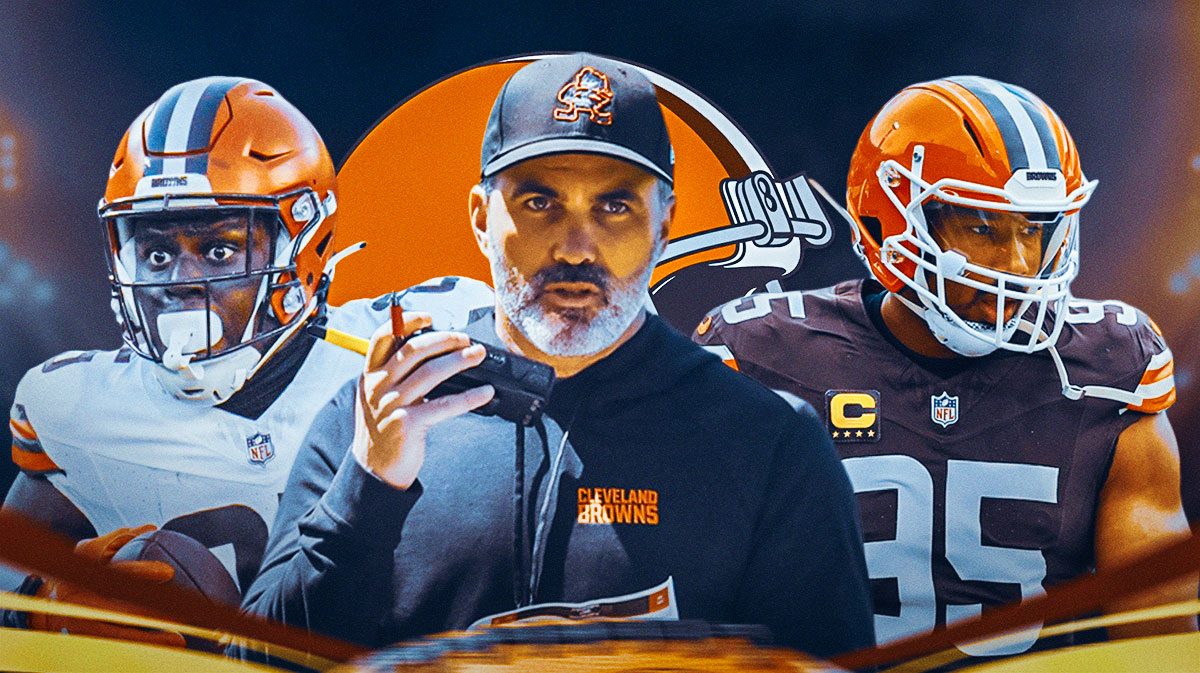 Coach Kevin Stefanski in the middle, Myles Garrett and David Njoku around him, Cleveland Browns logo in the background