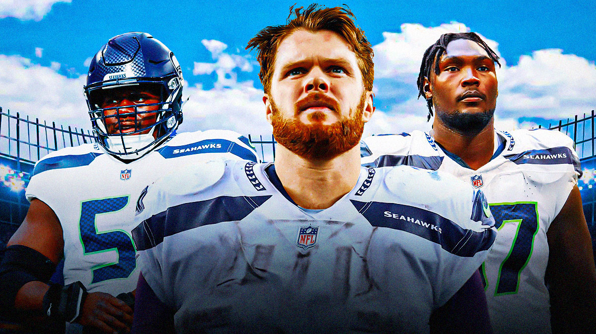 Sam Darnold in the middle, Olu Oluwatimi and Charles Cross around him, Seattle Seahawks logo in the background
