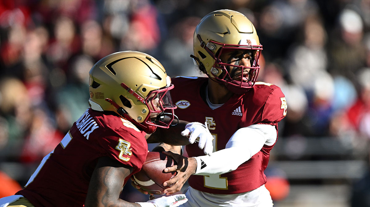 Boston College Eagles quarterback Thomas Castellanos (1) hands the ball off to unning back Kye Robichaux (5) during the first half at Alumni Stadium. Mandatory Credit: Brian Fluharty-Imagn Images