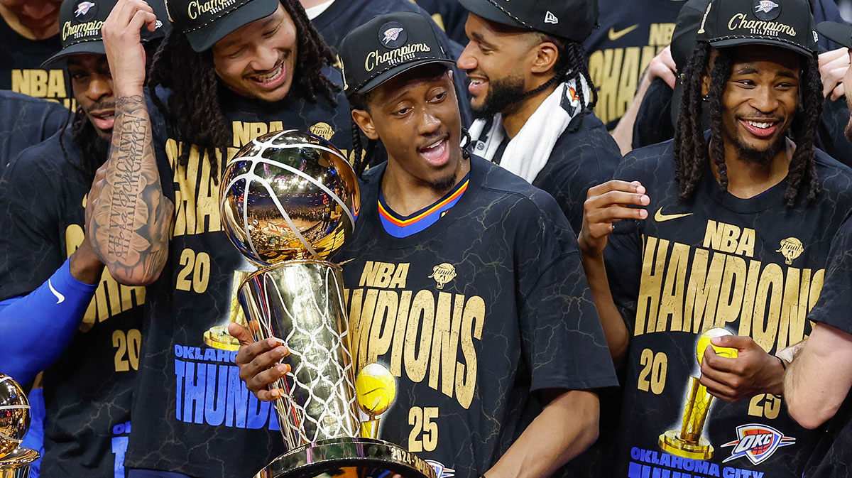 Thunder forward Jalen Williams (8) holds the NBA Larry O'Brien Championship Trophy at the end of game seven of the 2025 NBA Finals after defeating the Indiana Pacers at Paycom Center
