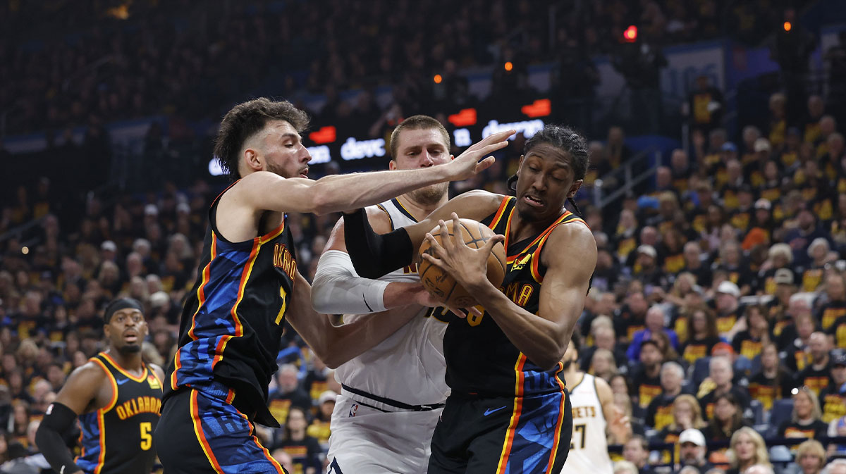Thunder forward Jalen Williams (8) and forward Chet Holmgren (7) steal the ball from Denver Nuggets center Nikola Jokic (15) during the second quarter during game one of the second round for the 2025 NBA Playoffs at Paycom Center